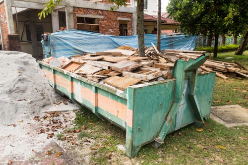 Professional house clearance workers sorting items in a Nottinghill property